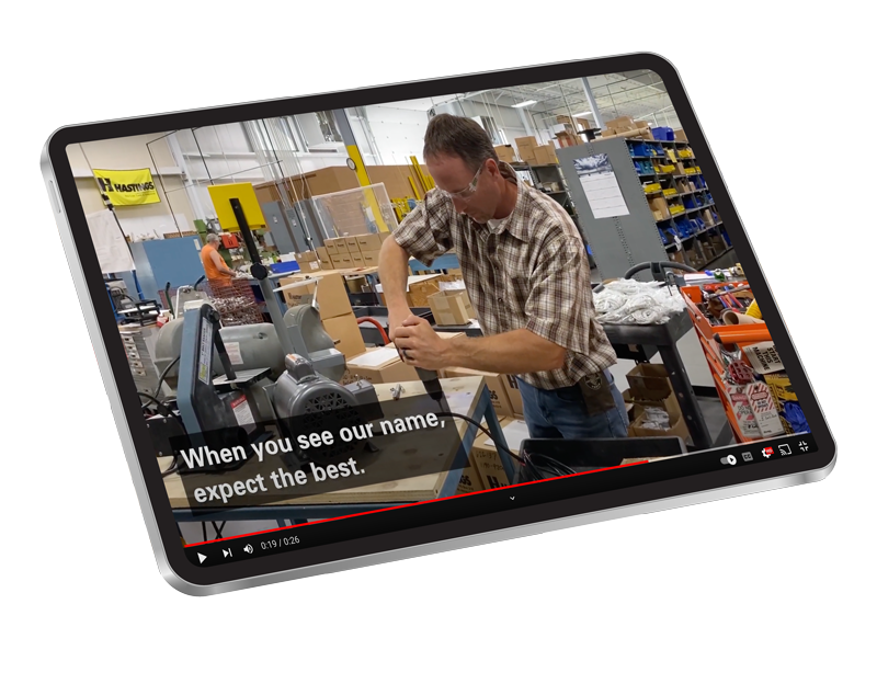 Image displaying an iPad showing a Hastings video.