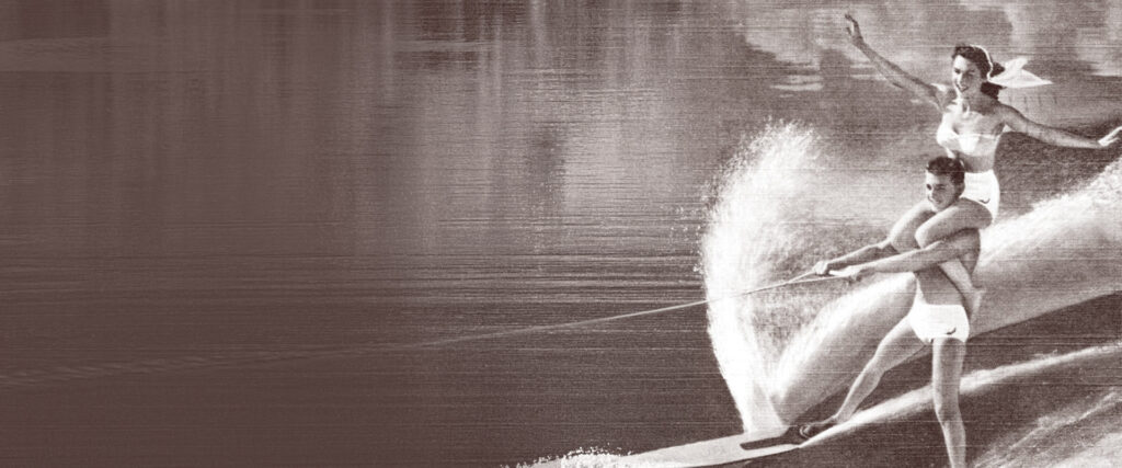 LKF Holistic Partners are represented by a water skiing pair being pulled by a boat.